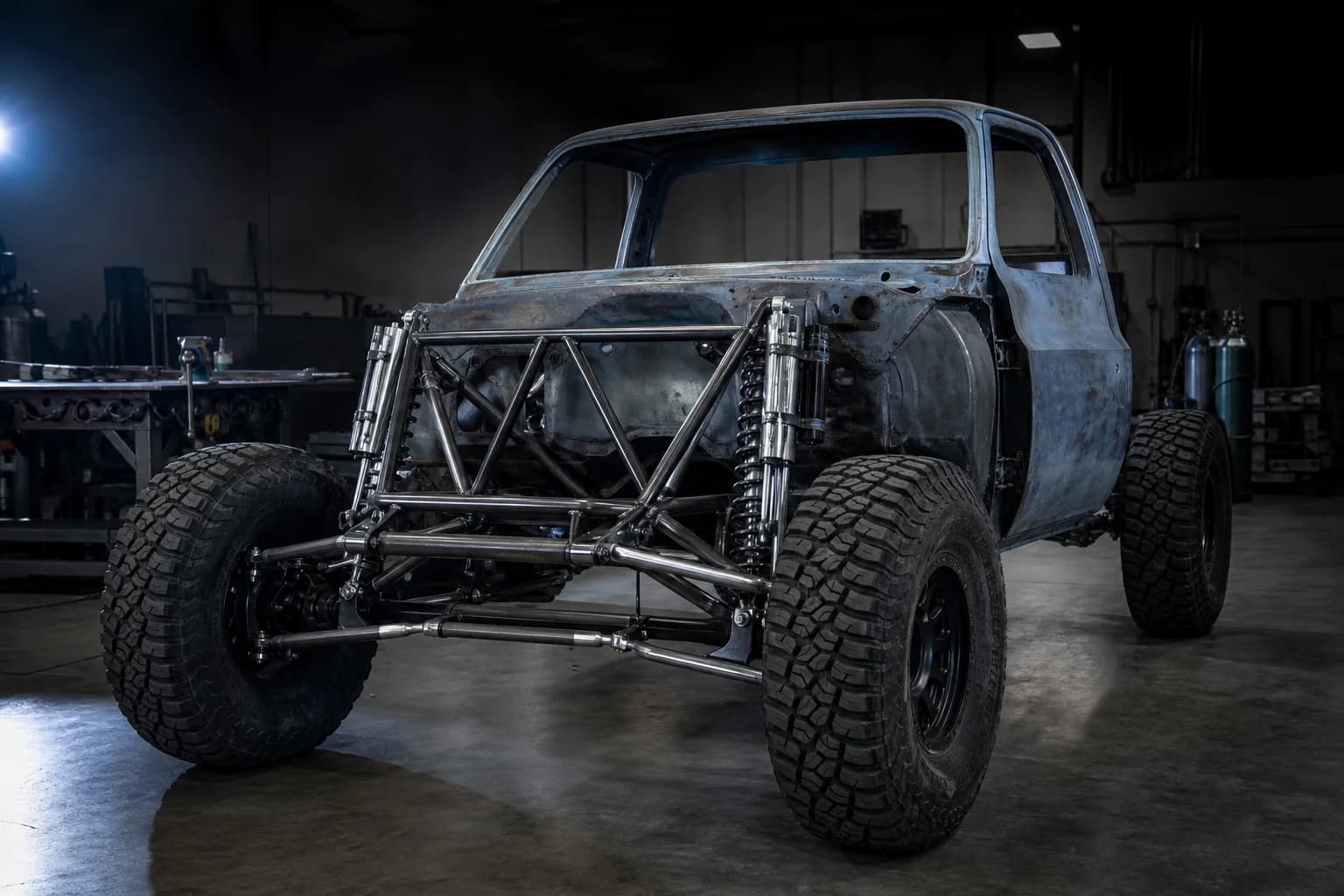 Long-travel pre-runner square body Chevy chassis with the cab mounted and suspension installed